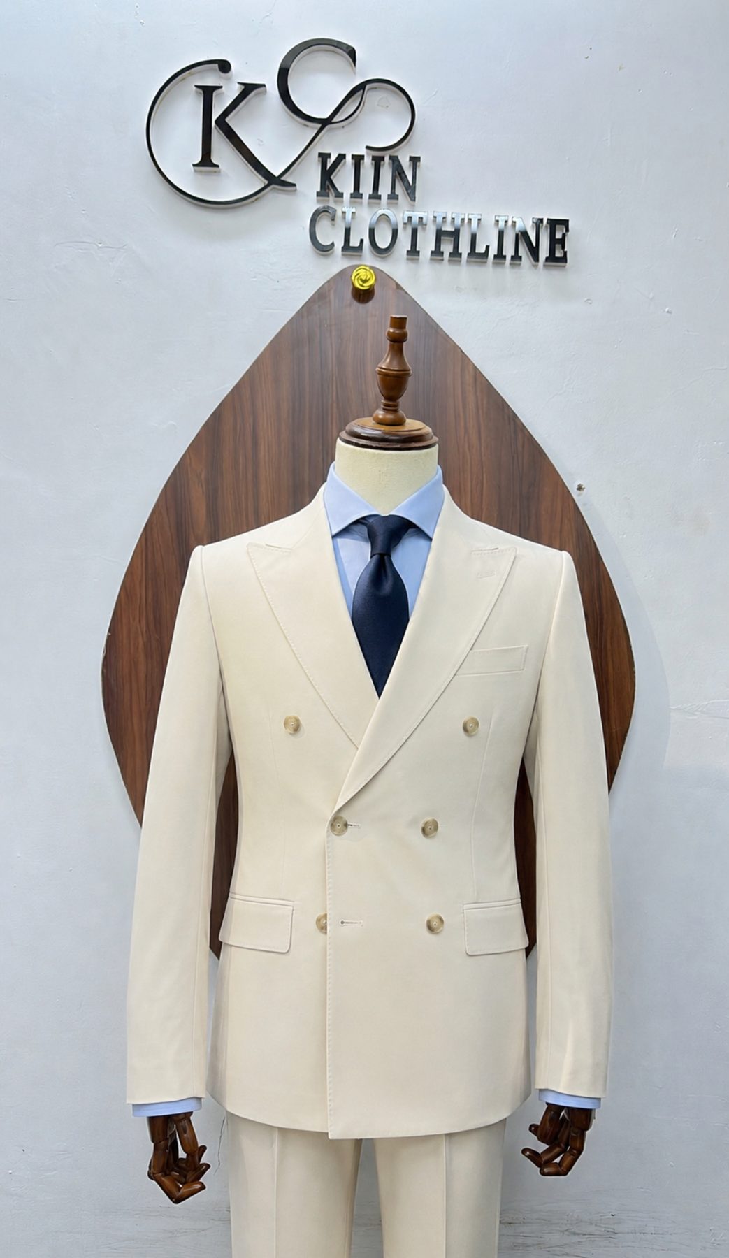Cream double-breasted suit in the Kiin Clothline studio
